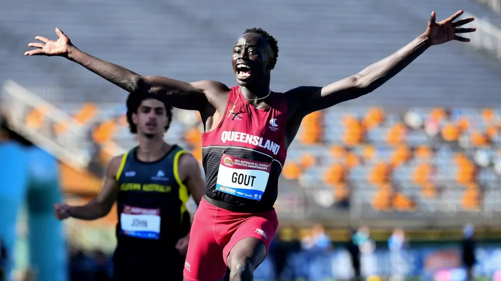 Athletics - Australian All Schools Athletics Championships - Brisbane, Australia - December 6, 2024 Gout Gout of Australia celebrates winning the U18s, 100m final Jono Searle/AAP Image via REUTERS   ATTENTION EDITORS - THIS IMAGE WAS PROVIDED BY A THIRD PARTY. NO RESALES. NO ARCHIVES. AUSTRALIA OUT. NEW ZEALAND OUT