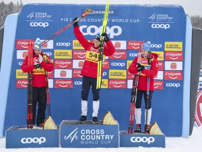 06 December 2024, Norway, Lillehammer: (L-R) Norwegian cross-country skiers second placed Simen Hegstad Krueger, winner Martin Loewstroem Nyenget and third placed Harald Oestberg Amundsen celebrate on the podium after the World Cup cross-country skiing at the Birkebeineren Ski Stadium. Photo: Geir Olsen/NTB/dpa