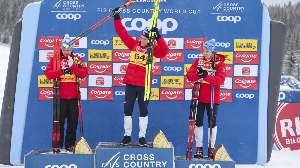 06 December 2024, Norway, Lillehammer: (L-R) Norwegian cross-country skiers second placed Simen Hegstad Krueger, winner Martin Loewstroem Nyenget and third placed Harald Oestberg Amundsen celebrate on the podium after the World Cup cross-country skiing at the Birkebeineren Ski Stadium. Photo: Geir Olsen/NTB/dpa