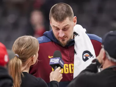 Dec 8, 2024; Atlanta, Georgia, USA; Denver Nuggets center Nikola Jokic (15) reacts while being interviewed after the game against the Atlanta Hawks during the second half at State Farm Arena. Mandatory Credit: Dale Zanine-Imagn Images