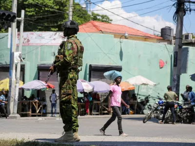 FILE PHOTO: A Kenyan police officer patrols as the country is facing emergency food insecurity while immersed in a social and political crisis, in Port-au-Prince, Haiti October 3, 2024. REUTERS/Jean Feguens Regala//File Photo