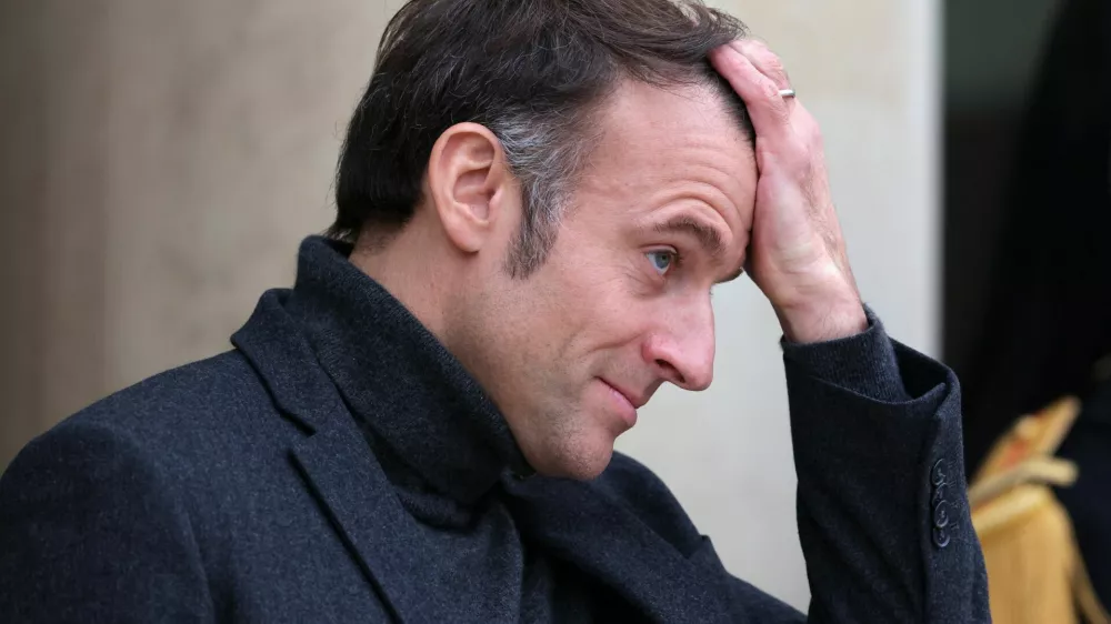 French President Emmanuel Macron gestures as he waits for the arrival of a guest at the Elysee Palace in Paris, France, December 9, 2024. REUTERS/Kevin Coombs