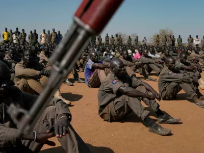 FILE PHOTO: South Sudan People's Defence Forces (SSPDF), South Sudan Opposition Alliance (SSOA), and The Sudan People's Liberation Movement in Opposition (SPLM-IO) soldiers gather at the training site for the joint force to protect VIPs in Gorom outside Juba, South Sudan February 17, 2020. REUTERS/Andreea Campeanu/File Photo