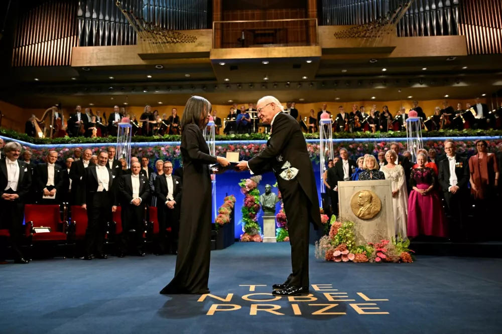 Nobel laureate in Literature Han Kang receives her award at the Nobel Prize award ceremony at the Konserthuset in Stockholm, Sweden December 10, 2024. TT News Agency/Henrik Montgomery via REUTERS ATTENTION EDITORS - THIS IMAGE WAS PROVIDED BY A THIRD PARTY. SWEDEN OUT. NO COMMERCIAL OR EDITORIAL SALES IN SWEDEN.