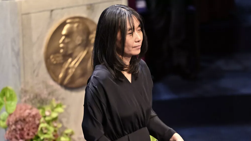 Nobel laureate in literature Han Kang holds her award during the Nobel Prize ceremony in Stockholm, Sweden, Tuesday, Dec. 10, 2024. (Jonas Ekstroemer/TT News Agency via AP)