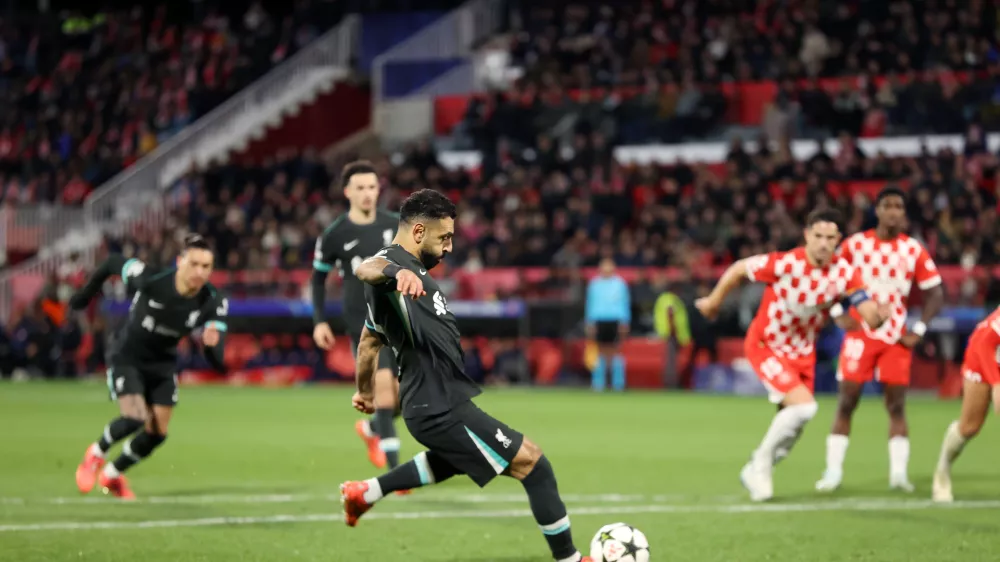 10 December 2024, Spain, Girona: Liverpool's Mohamed Salah scores his side's first goal during the UEFA Champions League soccer match between Girona and Liverpool at Estadi Montilivi. Photo: Liam Mcburney/PA Wire/dpa