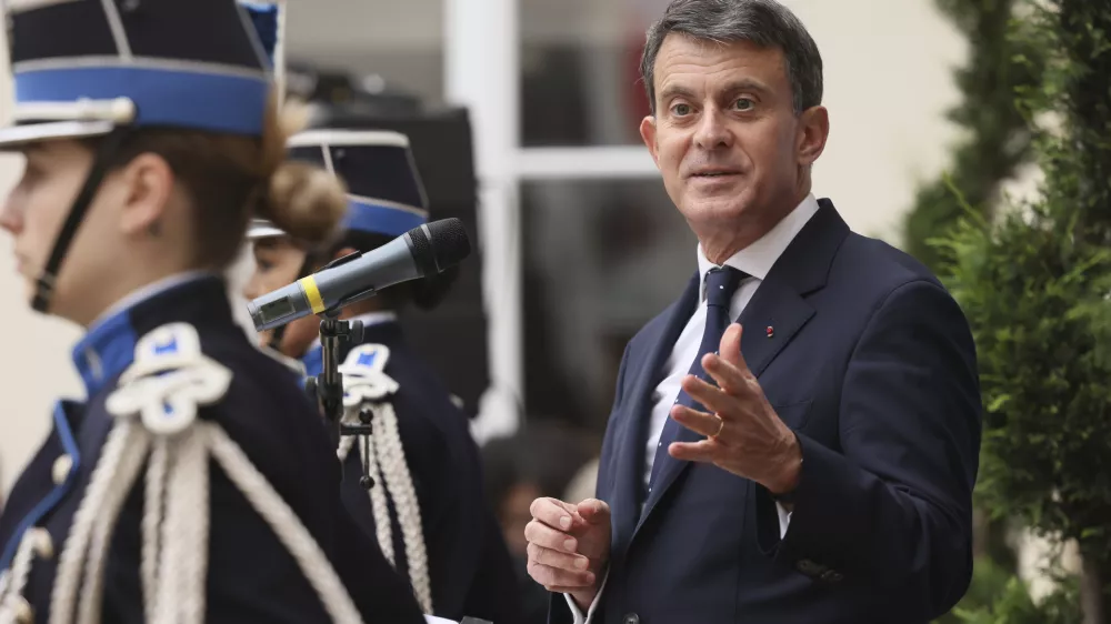 Newly named Minister for Overseas Affairs Emmanuel Valls delivers his speech after the hand over ceremony, in Paris, Tuesday, Dec. 24, 2024. (AP Photo/Thomas Padilla)