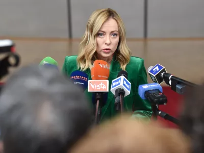 FILED - 15 December 2023, Belgium, Brussels: Italian Prime Minister Giorgia Meloni speaks to media upon her arrival to attend the second day of the EU Summit. Meloni has accused a German search-and-rescue organization of ignoring the role of human traffickers in the deaths of thousands in response to accusations she was working on a "dystopian migration policy" with Libya. Photo: Gaetan Claessens/EU COUNCIL/dpa - ATTENTION: editorial use only and only if the credit mentioned above is referenced in full