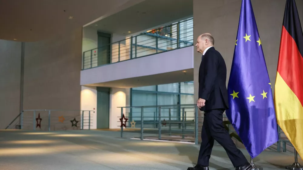 German Chancellor Olaf Scholz walks following speaking to reporters, after a December 16 confidence vote request was submitted, in Berlin, Germany December 11, 2024. REUTERS/Liesa Johannssen   TPX IMAGES OF THE DAY