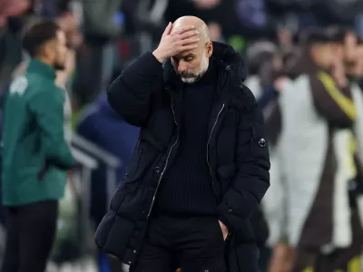 Soccer Football - Champions League - Juventus v Manchester City - Allianz Stadium, Turin, Italy - December 11, 2024 Manchester City manager Pep Guardiola reacts at the end of the match REUTERS/Claudia Greco