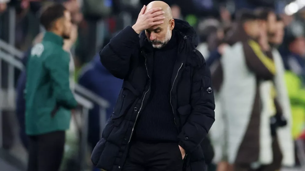 Soccer Football - Champions League - Juventus v Manchester City - Allianz Stadium, Turin, Italy - December 11, 2024 Manchester City manager Pep Guardiola reacts at the end of the match REUTERS/Claudia Greco