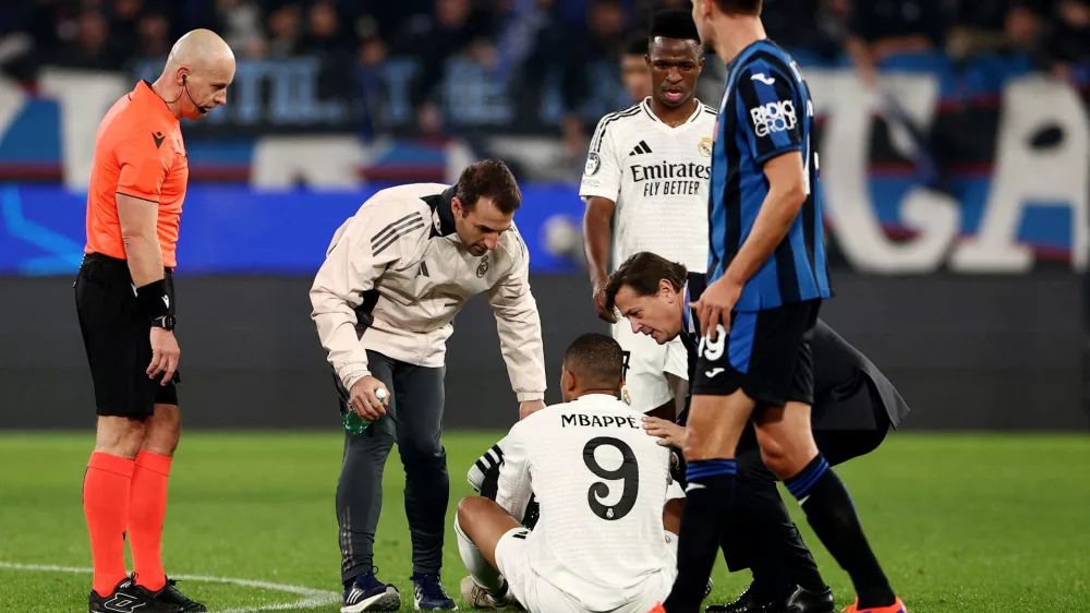 FILE PHOTO: Soccer Football - Champions League - Atalanta v Real Madrid - Gewiss Stadium, Bergamo, Italy - December 10, 2024 Real Madrid's Kylian Mbappe receives medical attention after sustaining an injury REUTERS/Guglielmo Mangiapane/File Photo