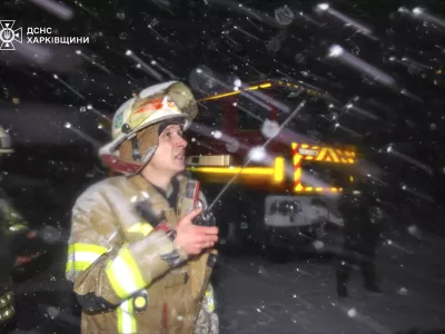 In this photo provided by the Ukrainian Emergency Service, firefighters work on the site of a damaged building after a Russian drone attack in Kharkiv, Ukraine, early Friday, Dec. 13, 2024. (Ukrainian Emergency Service via AP Photo)