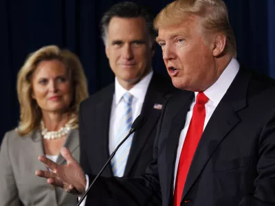 FILE - Donald Trump speaks at a news conference in Las Vegas, Thursday, Feb. 2, 2012, to endorse Republican presidential candidate, former Massachusetts Gov. Mitt Romney, center, accompanied by Romney's wife Ann. (AP Photo/Gerald Herbert, File)