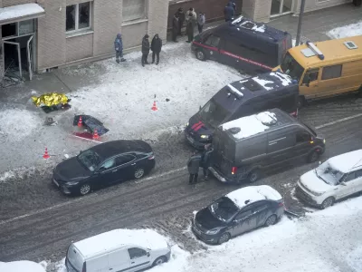 Investigators stand at the place where Lt. General Igor Kirillov, the head of Russia's Nuclear, Biological, and Chemical Defence Forces and his assistant Ilya Polikarpov were killed by an explosive device planted close to a residential apartment's block in Moscow, Russia, Tuesday, Dec. 17, 2024. (AP Photo)