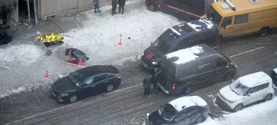 Investigators stand at the place where Lt. General Igor Kirillov, the head of Russia's Nuclear, Biological, and Chemical Defence Forces and his assistant Ilya Polikarpov were killed by an explosive device planted close to a residential apartment's block in Moscow, Russia, Tuesday, Dec. 17, 2024. (AP Photo)