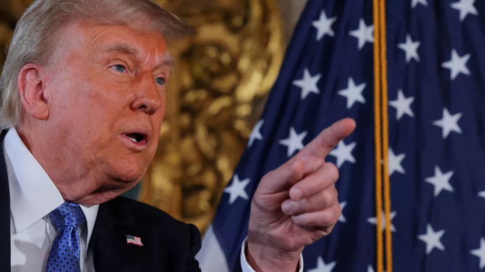 FILE PHOTO: U.S. President-elect Donald Trump delivers remarks at Mar-a-Lago in Palm Beach, Florida, U.S., December 16, 2024. REUTERS/Brian Snyder/File Photo