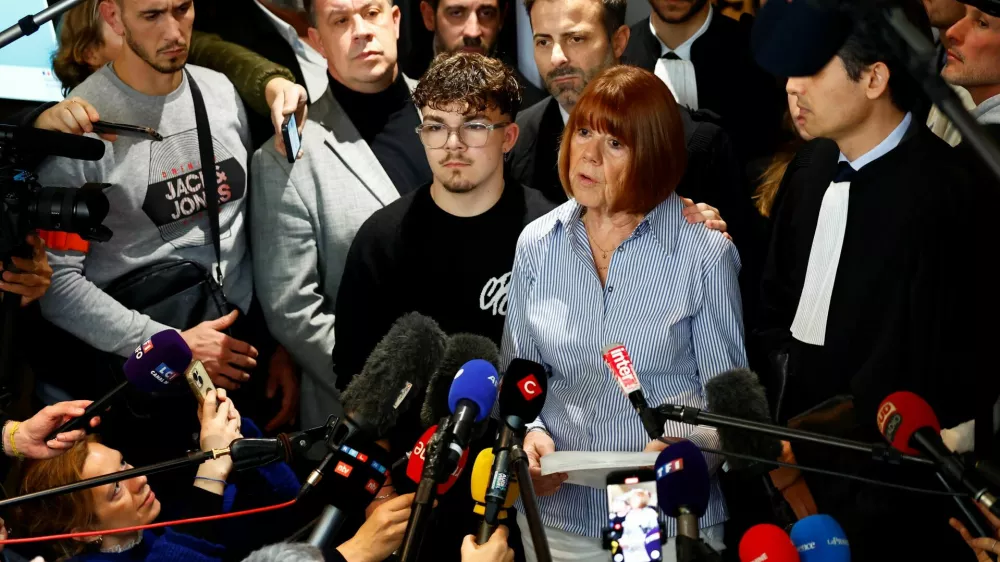 Frenchwoman Gisele Pelicot, the victim of an alleged mass rape orchestrated by her then-husband Dominique Pelicot at their home in the southern French town of Mazan, talks to journalists after the verdict in the trial for Dominique Pelicot and 50 co-accused, at the courthouse in Avignon, France, December 19, 2024. REUTERS/Manon Cruz