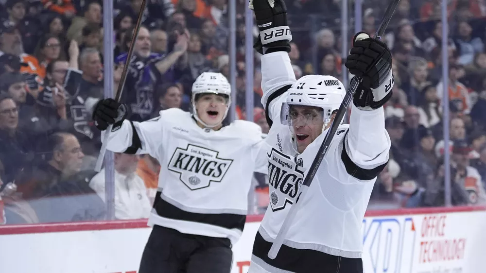 Los Angeles Kings' Anze Kopitar, right, celebrates after scoring a goal during the third period of an NHL hockey game against the Philadelphia Flyers, Thursday, Dec. 19, 2024, in Philadelphia. (AP Photo/Matt Slocum)