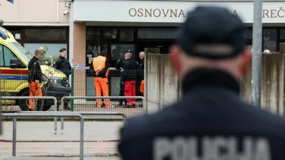 A police officer stands, following a knife attack in a primary school, in Zagreb, Croatia, December 20, 2024. REUTERS/Antonio Bronic