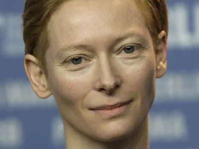 FILE - In this Thursday, Feb. 5, 2009 file photo, British actress Tilda Swinton, president of the international jury for the 59th Berlinale, holds the opening news conference in Berlin, Germany. Academy Award-winner Tilda Swinton is spending part of the summer hauling a mobile movie theater across the Scottish Highlands. Swinton and fellow film fans are transporting the movie truck through towns and villages for a traveling film festival. Most of the time they drive, but volunteers are pulling the 37-tonne (40 ton) truck for part of the journey on foot. Swinton said the foot slog a tribute to movies and the Scottish landscape was a "mad idea" that seemed appropriate. (AP Photo/Herbert Knosowski, File)