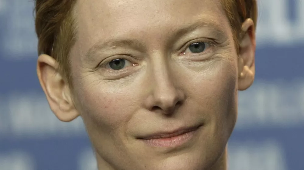 FILE - In this Thursday, Feb. 5, 2009 file photo, British actress Tilda Swinton, president of the international jury for the 59th Berlinale, holds the opening news conference in Berlin, Germany. Academy Award-winner Tilda Swinton is spending part of the summer hauling a mobile movie theater across the Scottish Highlands. Swinton and fellow film fans are transporting the movie truck through towns and villages for a traveling film festival. Most of the time they drive, but volunteers are pulling the 37-tonne (40 ton) truck for part of the journey on foot. Swinton said the foot slog a tribute to movies and the Scottish landscape was a "mad idea" that seemed appropriate. (AP Photo/Herbert Knosowski, File)