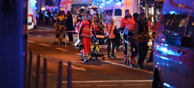 20 December 2024, Saxony-Anhalt, Magdeburg: Emergency services, police and firefighters are on duty to help injured people after a car drove into the Christmas market in Magdeburg. Photo: Heiko Rebsch/dpa - ATTENTION: individual(s) has/have been pixelated for legal reasons