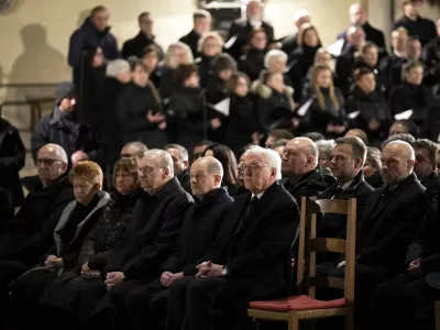 German President Frank-Walter Steinmeier, foreground, and Chancellor Olaf Scholza, next to him, attend memorial service for victims of Friday's Christmas Market attack, where a car drove into a crowd, in Magdeburg, Germany, Saturday, Dec. 21, 2024. (AP Photo/Ebrahim Noroozi)