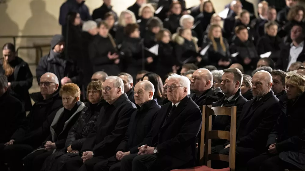 German President Frank-Walter Steinmeier, foreground, and Chancellor Olaf Scholza, next to him, attend memorial service for victims of Friday's Christmas Market attack, where a car drove into a crowd, in Magdeburg, Germany, Saturday, Dec. 21, 2024. (AP Photo/Ebrahim Noroozi)