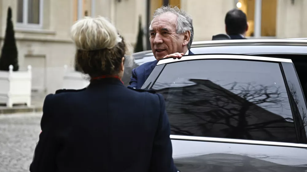 French Prime Minister Francois Bayrou arrives for a meeting at a crisis centre at the Interior Ministry in Paris, Monday Dec. 23, 2024, following the cyclone Chido's passage over the French Indian Ocean territory of Mayotte. French President Emmanuel Macron's office announced a new government Monday, after the previous Cabinet collapsed in a historic vote prompted by fighting over the country's budget. (Julien de Rosa, Pool via AP)