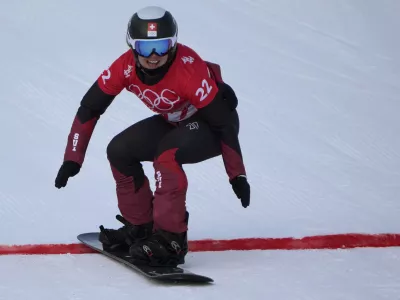 FILE - Switzerland's Sophie Hediger competes during the women's snowboard cross qualification round at the 2022 Winter Olympics, Feb. 9, 2022, in Zhangjiakou, China. (AP Photo/Aaron Favila, File)