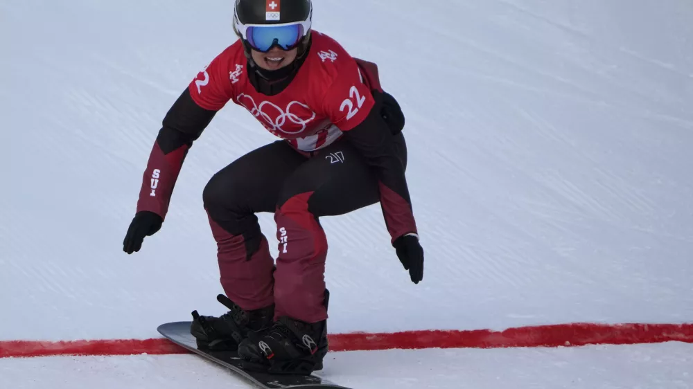 FILE - Switzerland's Sophie Hediger competes during the women's snowboard cross qualification round at the 2022 Winter Olympics, Feb. 9, 2022, in Zhangjiakou, China. (AP Photo/Aaron Favila, File)