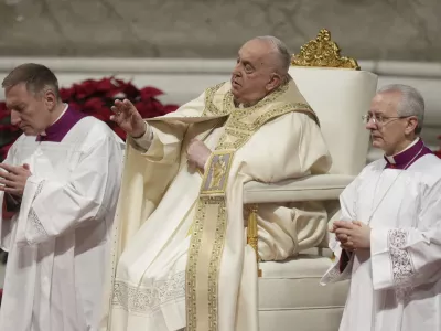 Pope Francis presides over the Christmas Eve Mass in St. Peter's Basilica at The Vatican, Tuesday, Dec. 24, 2024, after opening the basilica's holy door marking the start of the Catholic jubilar year 2025. (AP Photo/Andrew Medichini)