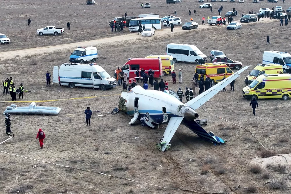 The wreckage of Azerbaijan Airlines Embraer 190 lays on the ground near the airport of Aktau, Kazakhstan, Wednesday, Dec. 25, 2024. (AP Photo/Azamat Sarsenbayev)