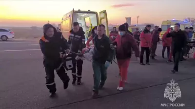 In this image released by the Russian Emergency Ministry Press Service, rescuers carry a wounded passenger near the Kazakhstani city of Aktau, Thursday, Dec. 26, 2024, after a plane of Azerbaijani Airline crashed. (Russian Emergency Ministry Press Service via AP)