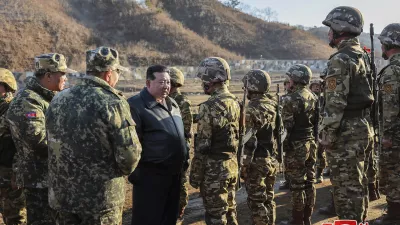 FILE - In this photo provided by the North Korean government, North Korean leader Kim Jong Un, center left, meets soldiers during a visit to a western operational training base in North Korea Wednesday, March 6, 2024. Independent journalists were not given access to cover the event depicted in this image distributed by the North Korean government. The content of this image is as provided and cannot be independently verified. Korean language watermark on image as provided by source reads: "KCNA" which is the abbreviation for Korean Central News Agency. (Korean Central News Agency/Korea News Service via AP, File)