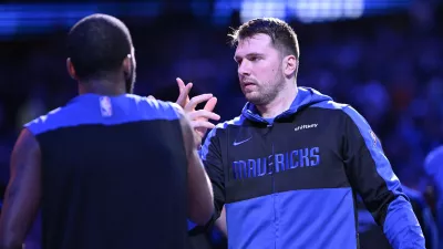 Dec 25, 2024; Dallas, Texas, USA; Dallas Mavericks guard Kyrie Irving (11) greets guard Luka Doncic (77) before the game against the Minnesota Timberwolves at the American Airlines Center. Mandatory Credit: Jerome Miron-Imagn Images