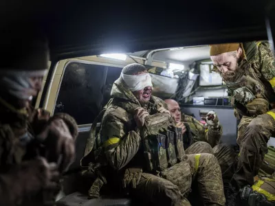 Injured Ukrainian servicemen arrive from the battlefield at Medical Service "Ulf" of the 108th Separate Battalion "Da Vinci Wolves" on Pokrovsk direction, Ukraine, Dec. 23, 2024. (AP Photo/Evgeniy Maloletka)