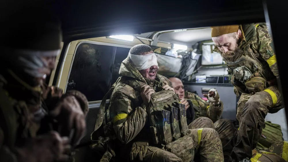 Injured Ukrainian servicemen arrive from the battlefield at Medical Service "Ulf" of the 108th Separate Battalion "Da Vinci Wolves" on Pokrovsk direction, Ukraine, Dec. 23, 2024. (AP Photo/Evgeniy Maloletka)