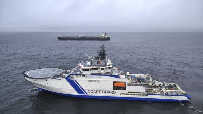 This photo provided by Rajavartiosto (Finnish Border Guard) on Thursday, Dec. 26, 2024, shows the oil tanker Eagle S, background, and the Finnish Border Guard ship Turva at sea outside Porkkalanniemi, Finland. The Eagle S was sailing at the same time in the area where the Finland-Estonia electrical link was disrupted on Wednesday. (Rajavartiosto via AP)