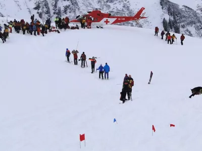 Rescue workers are seen at the site where two avalanches came down a mountainside in the Diemtig valley in the Bernese Oberland January 3, 2010. After a rescue team arrived on the scene, a second avalanche caught an unknown number of people involved in the search for a trapped skier on Sunday. The police said at least three other people are missing and believed to be buried under the snow from avalanches that killed three ski mountaineers and a doctor involved in the search and rescue operation after the first avalanche. Picture taken January 3, 2010. REUTERS/ Police of the canton Bern/Handout (SWITZERLAND - Tags: DISASTER ENVIRONMENT IMAGES OF THE DAY)