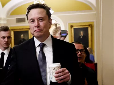 FILE PHOTO: Elon Musk walks on Capitol Hill on the day of a meeting with Senate Republican Leader-elect John Thune (R-SD), in Washington, U.S. December 5, 2024. REUTERS/Benoit Tessier/File Photo