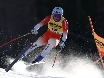 Switzerland's Alexis Monney speeds down the course during an alpine ski, men's World Cup downhill race, in Bormio, Italy, Saturday, Dec. 28, 2024. (AP Photo/Gabriele Facciotti)