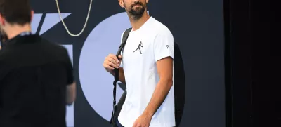 28 December 2024, Australia, Brisbane: Serbian tennis player Novak Djokovic arrives to a practice session prior to the Brisbane International at Queensland Tennis Centre in Brisbane. Photo: Jono Searle/AAP/dpa