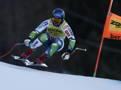 Slovenia's Miha Hrobat speeds down the course during an alpine ski, men's World Cup downhill race, in Bormio, Italy, Saturday, Dec. 28, 2024. (AP Photo/Gabriele Facciotti)