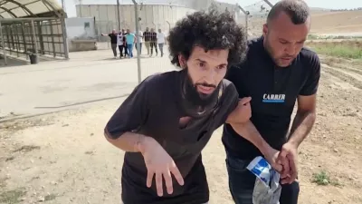 Palestinian prisoner Moazaz Obaiyat, released from Israeli jail, walks near Hebron in the Israeli-occupied West Bank, July 8, 2024 in this screengrab obtained from video. Reuters TV/via REUTERS