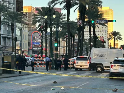 An Orleans Parish coroner's van is parked at the corner of Bourbon and Canal streets after a pickup truck was driven into a large crowd in the French Quarter of New Orleans, Louisiana, U.S. January 1, 2025. Marc Weiszer/USA TODAY NETWORK via REUTERS   NO RESALES. NO ARCHIVES. MANDATORY CREDIT