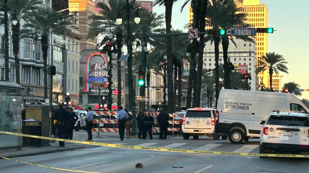 An Orleans Parish coroner's van is parked at the corner of Bourbon and Canal streets after a pickup truck was driven into a large crowd in the French Quarter of New Orleans, Louisiana, U.S. January 1, 2025. Marc Weiszer/USA TODAY NETWORK via REUTERS   NO RESALES. NO ARCHIVES. MANDATORY CREDIT