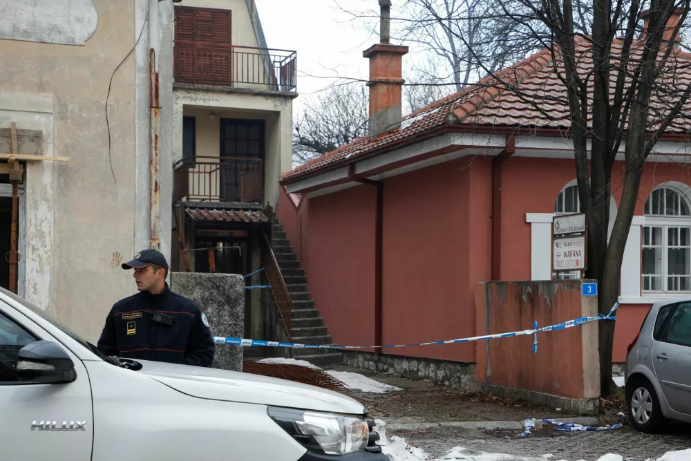 A police officer stands guard in front of restaurant where gunman opened fire and killed several people in Cetinje, Montenegro, January 2, 2025. REUTERS/Stevo Vasiljevic