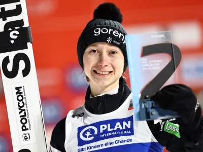 31 December 2024, Bavaria, Garmisch-Partenkirchen: Slovenia's Ski jumper Nika Prevc celebrates at the award ceremony after winning the women's large hill 2nd round of the ski jumping Two Nights Tour. Photo: Daniel Karmann/dpa